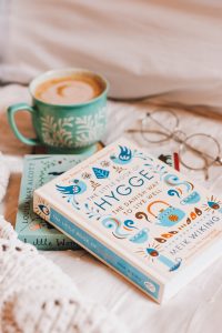 Hygge - Book, hot drink and cosy clothes